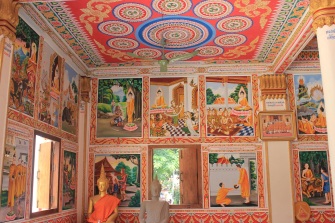 Immaculate interior paintings near Pha That Luang